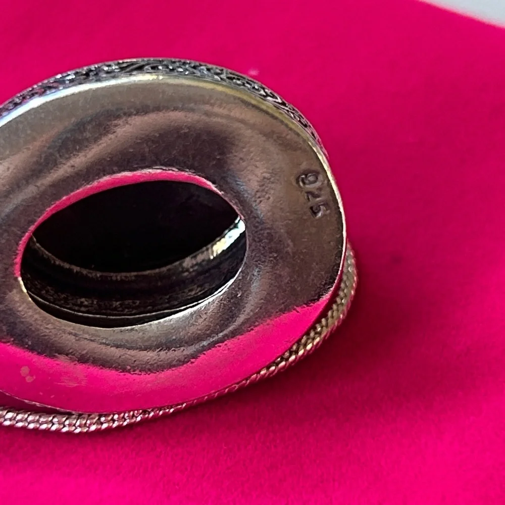 Vintage‎ dark brown black agate pendant with a sterling silver setting.